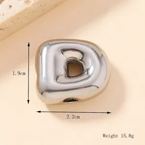 Macro shot of polished 3D bubble letter D pendant with dimensions 1.9cm by 2.2cm