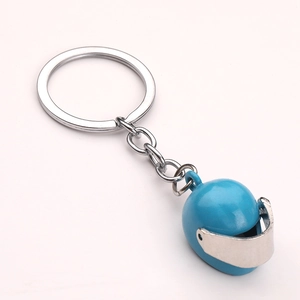 Close-up of a blue creative miniature motorcycle helmet keychain with a metallic ring