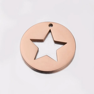 Polished rose gold stainless steel round charm with hollow star detail on white background