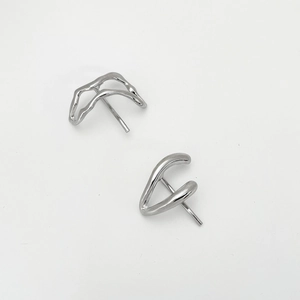 Detailed top view of irregular wave-shaped silver alloy hair pins with metallic luster