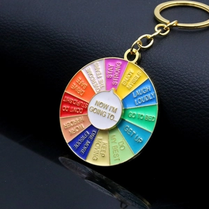 Macro view of rotating colorful enamel keychain with My Social Battery life slogans