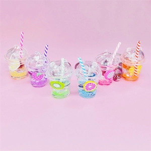 Luminous fruit tea cup keychains with miniature fruit slices and liquid in six colors