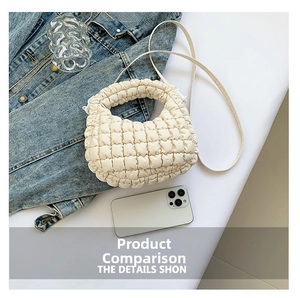 Detail of off-white quilted cloud bag featuring bubble texture and crossbody strap