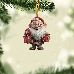 Close-up of cute Santa Claus acrylic pendant with red hat hanging on a pine tree branch
