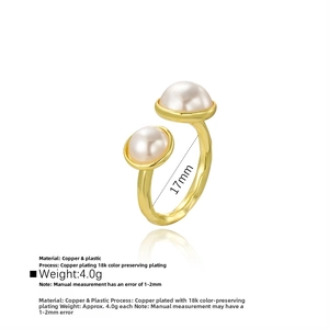 Detailed close-up of 18k gold plated copper ring with polished pearls and smooth finish