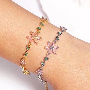 Elegant cherry blossom flower bracelet with pink crystals in gold and silver plating