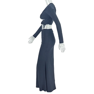 Detail view of the long sleeve cropped top and floor-length skirt on a mannequin
