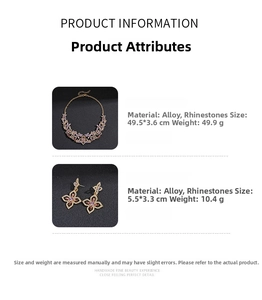 Close-up of golden hollow flower necklace and earrings set with rhinestones details