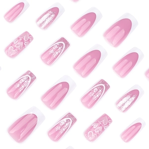 Pink and white coffin press-on nails featuring French tips, heart patterns and silver glitter