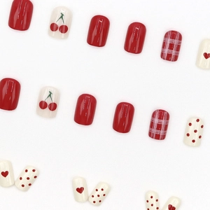 Red Christmas press-on nails set with cherry print, heart patterns and plaid designs