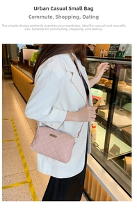 Detail of pink quilted small square bag with metal plate and adjustable strap