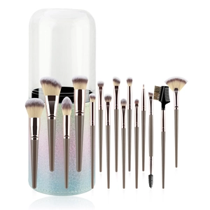 Detailed close-up of 15-piece makeup brush set with glitter storage tube and clear lid