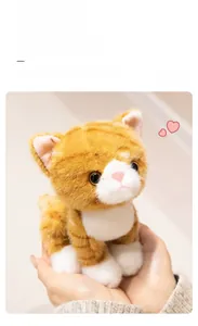 Detailed view of the soft orange and white plush cat with realistic fur texture