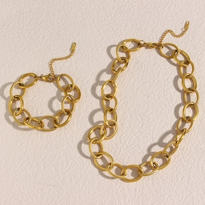 Chunky gold chain necklace and bracelet set in polished metal for women