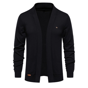Macro detail of high-quality black knit cardigan fabric and side pocket construction