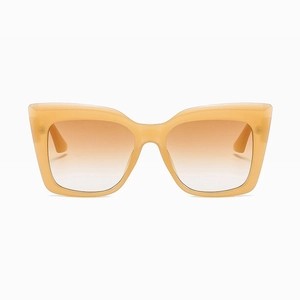 Detailed front view of beige cat-eye sunglasses with brown gradient lenses and large frame