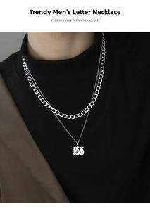 Close-up of double layer stainless steel Cuban chain necklace with 1997 pendant for men