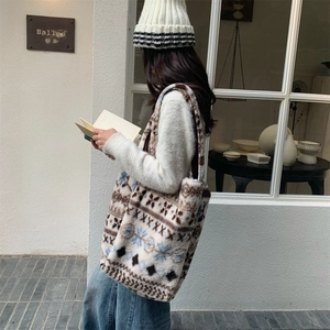 Detail of vintage plush jacquard tote bag with geometric patterns for winter fashion
