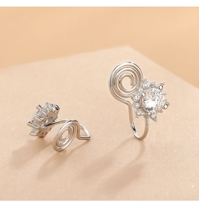 Macro view of S925 silver sunflower ear clip with pavé zirconia for non-pierced ears