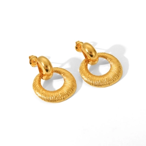 Detailed macro view of 18K gold-plated stainless steel earrings with vertical hammer texture