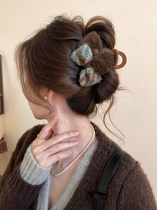 Brown flocking shark clip with plaid bow tie worn on hair for an elegant winter look