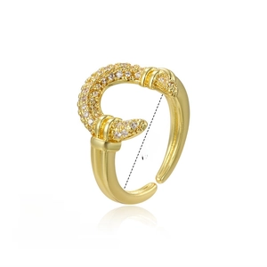 Macro detail of gold horseshoe ring showing 16mm inner diameter and zircon inlay