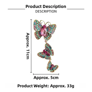 Detailed size view of vintage butterfly brooch with colorful rhinestones and gold finish