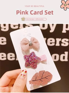 Detailed set of cute pink hair clips with bow star and leaf designs for children