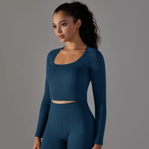 Detail of teal blue seamless yoga set showing unique honeycomb knit fabric and square neck