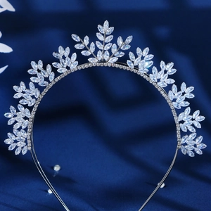 Close-up of sparkling zircon crystal leaf tiara headband with silver metal frame