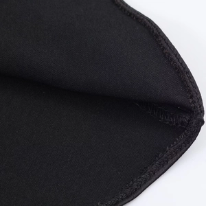 Close-up of black satin fabric showing premium texture and neat stitching details
