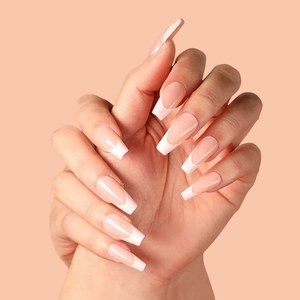 Classic nude French tip press-on nails in long ballerina shape with glossy finish