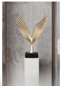 Macro shot of abstract angel wings sculpture with metallic finish and feather textures
