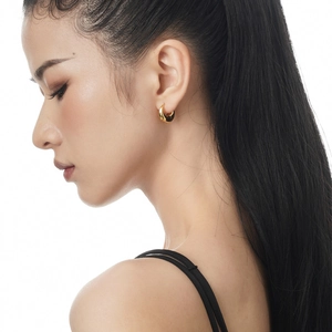 Minimalist S925 sterling silver crescent hoop earrings in gold finish on female model