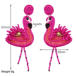 Handmade flamingo beaded earrings showing dimensions of 93mm height and 40mm width