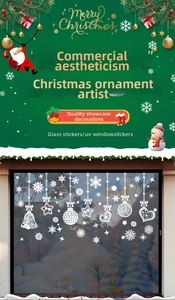 Detail of white snowflake window clings with intricate hollow patterns for Christmas