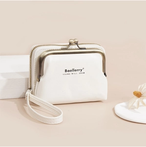 Detailed macro view of white PU leather wallet featuring metal frame and wristlet strap