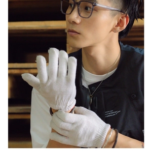 Detailed side view of stylish oversized black frame glasses worn by a model in a retro setting