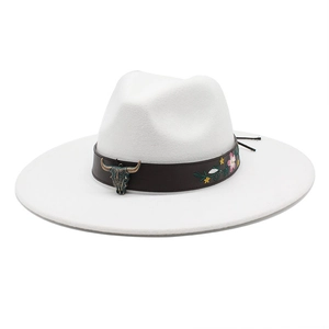 White western cowboy hat with floral embroidered leather band and bull skull metal ornament
