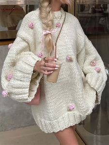 Elegant cream knit sweater dress with pink floral accents in a relaxed fit for women