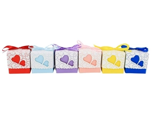 Detail showing various colors of hollow double heart candy boxes with matching ribbon bows