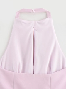 Detail of pink halter top neckline with back tie ribbon and high-quality fabric texture