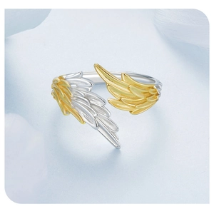 Detailed shot of two-tone angel wing open ring in silver and 14K gold finish