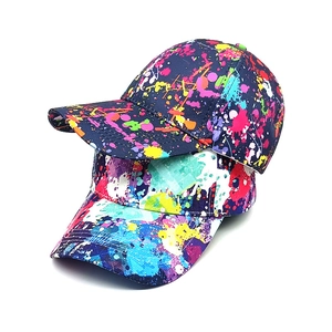 Graffiti print baseball caps with colorful splatter design and trendy hip-hop street style