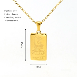 Close-up of 18k gold plated stainless steel square pendant with Buddhist carving