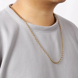 Elegant gold titanium steel pearl chain necklace worn by a model against a white backdrop