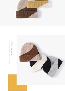Detail of color-block ribbed knit beanie featuring thick wool texture in neutral shades