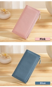 Detail of pink and blue pebble leather long wallets with zipper and wrist straps
