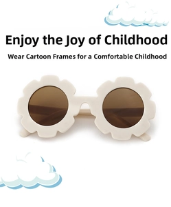 Detail of flower-shaped cream kids sunglasses with dark brown round lenses