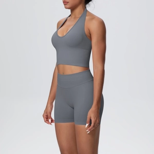 Side view of seamless knitted yoga set with halter v-neck top and high waist shorts